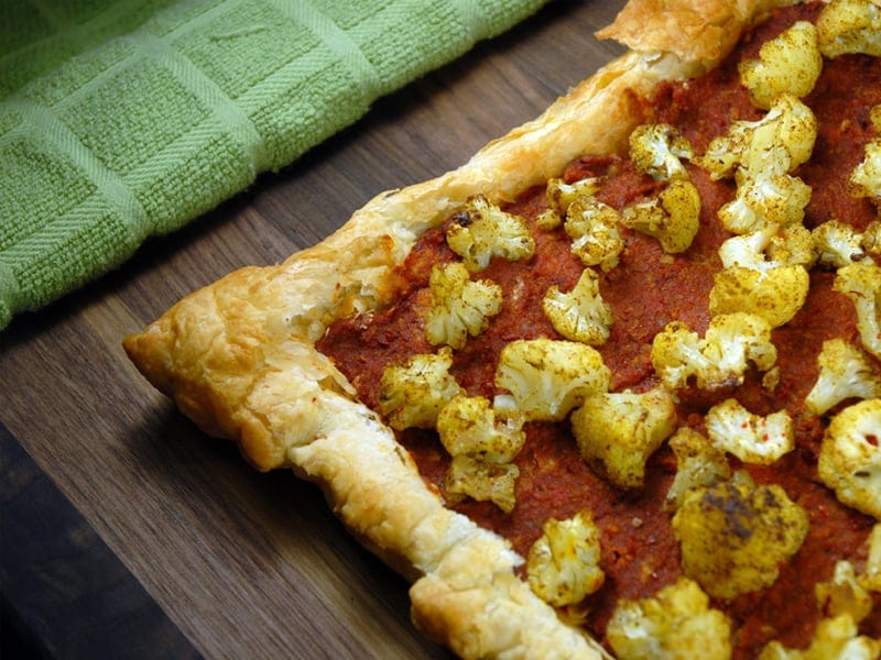 Muhammara Tart topped with Ras el Hanout Cauliflower